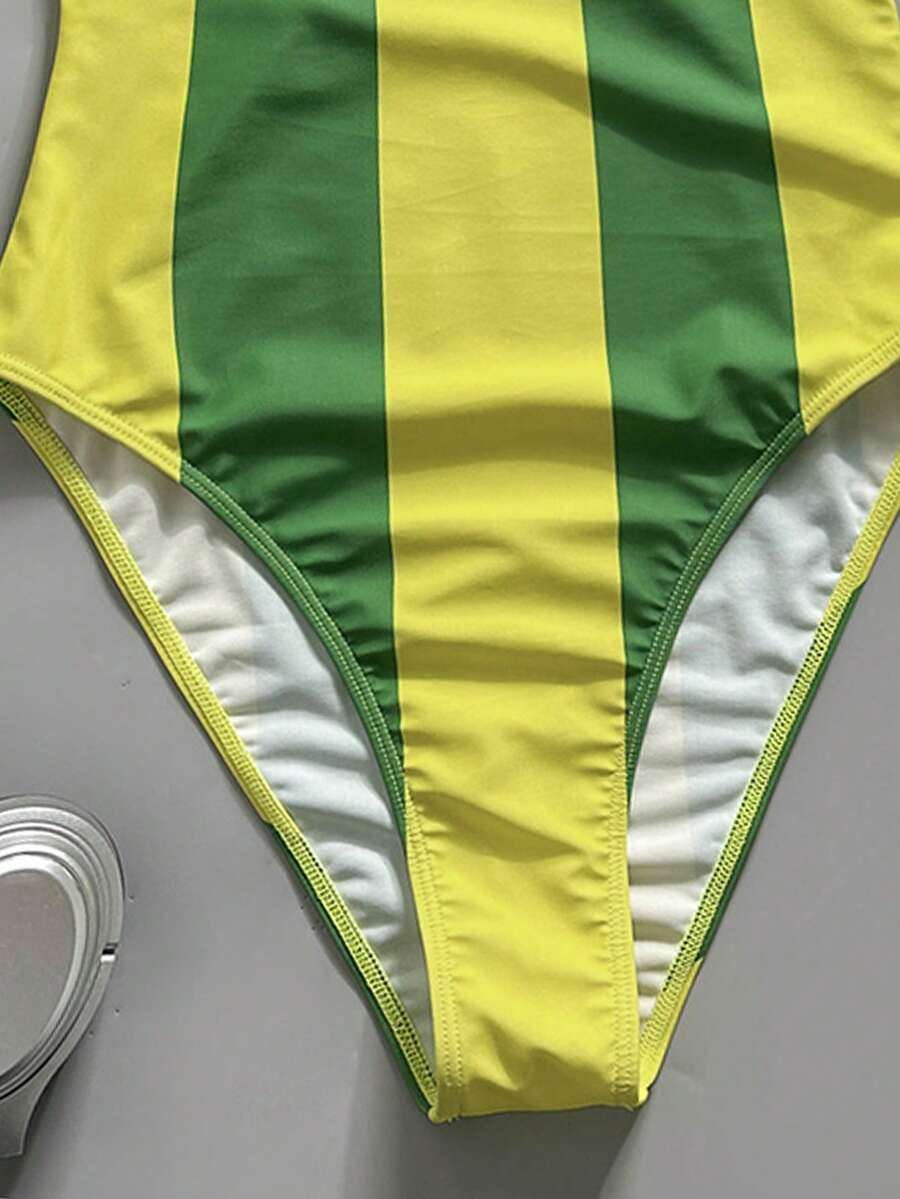Women's solid color one-piece swimsuit featuring a backless scoop neck design and high cut fit