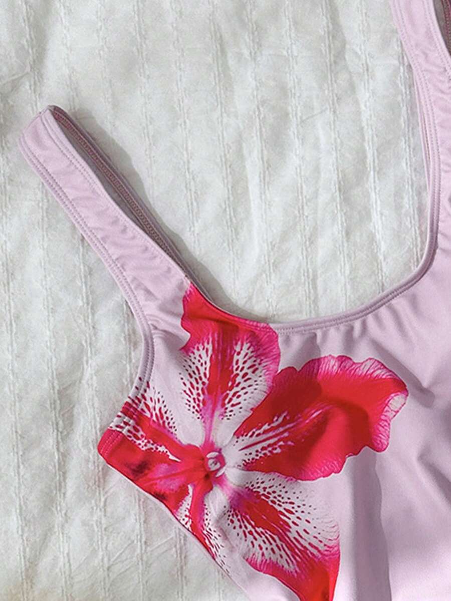 Women's solid color one-piece swimsuit featuring a backless scoop neck design and high cut fit