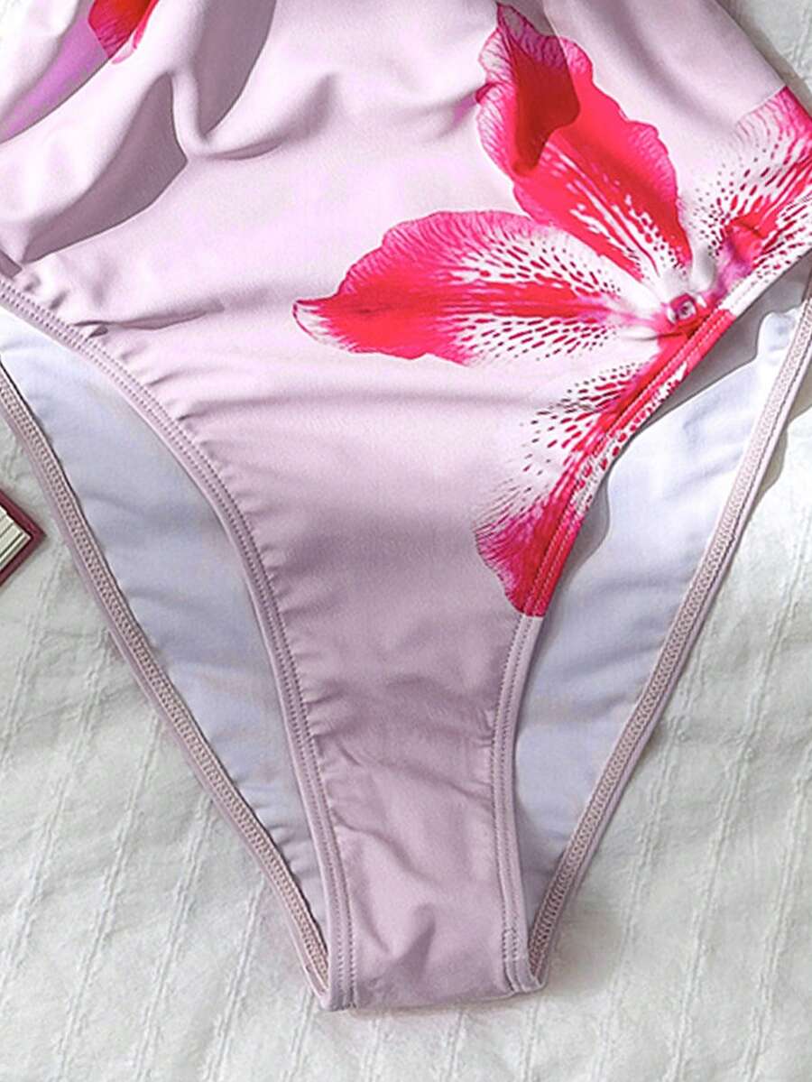 Women's solid color one-piece swimsuit featuring a backless scoop neck design and high cut fit