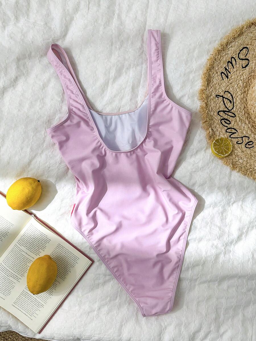 Women's solid color one-piece swimsuit featuring a backless scoop neck design and high cut fit
