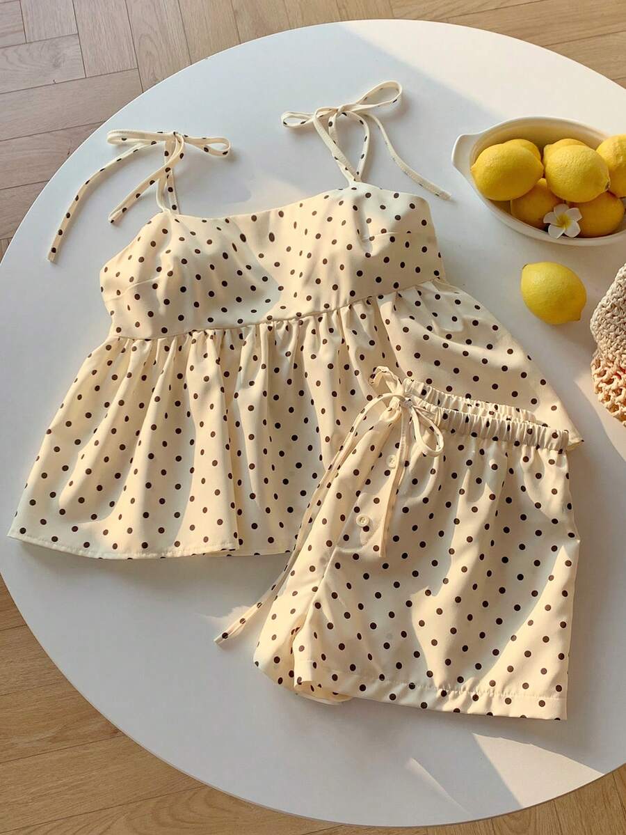Tween girl 2-piece summer set with a black and white sleeveless striped spaghetti strap tank top with ruffle details and matching casual shorts.