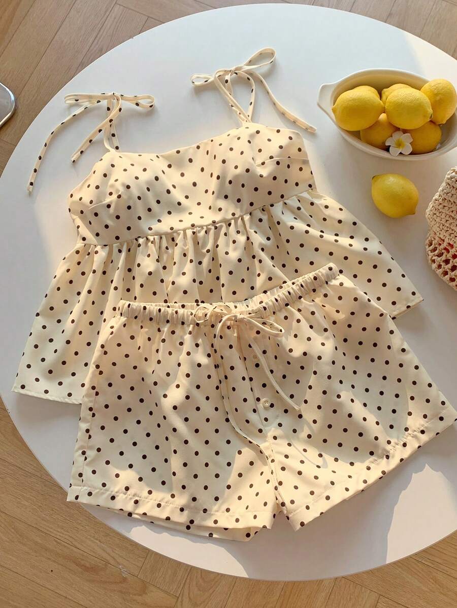 Tween girl 2-piece summer set with a black and white sleeveless striped spaghetti strap tank top with ruffle details and matching casual shorts.