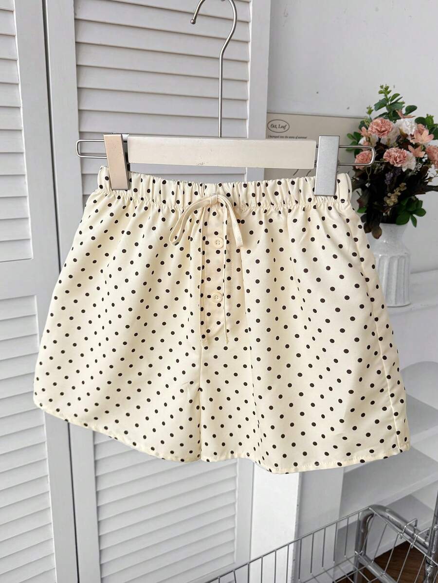 Tween girl 2-piece summer set with a black and white sleeveless striped spaghetti strap tank top with ruffle details and matching casual shorts.
