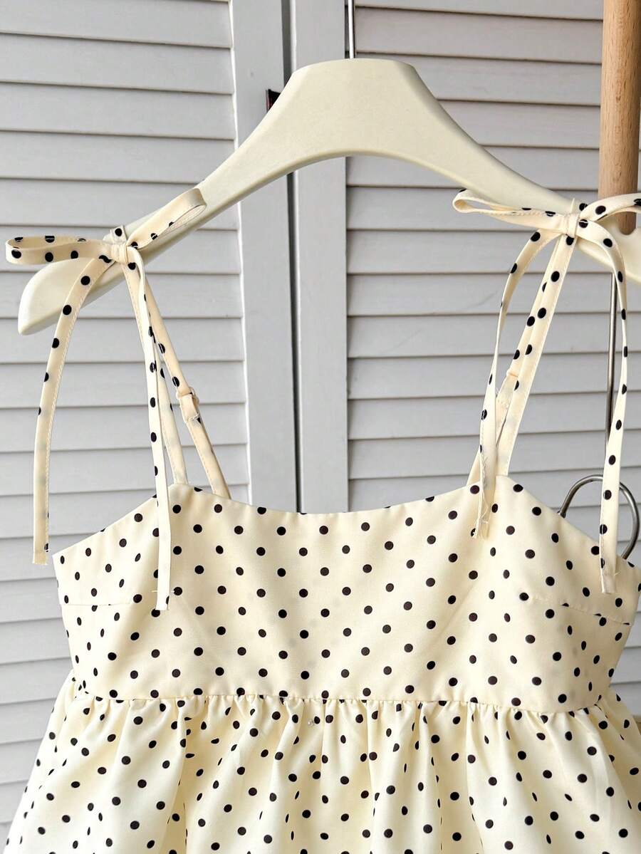 Tween girl 2-piece summer set with a black and white sleeveless striped spaghetti strap tank top with ruffle details and matching casual shorts.