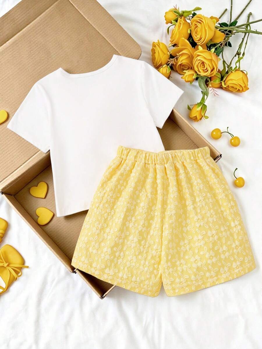 Tween girls 2-piece blue outfit featuring a short sleeve round neck t-shirt with a bow front detail and an asymmetric wrap skort.