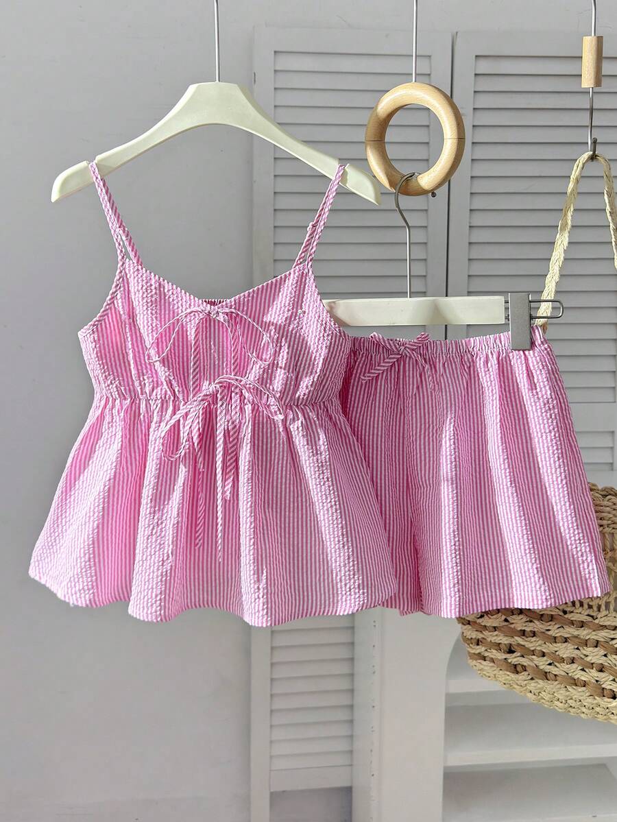 Tween girl 2-piece summer set with a black and white sleeveless striped spaghetti strap tank top with ruffle details and matching casual shorts.