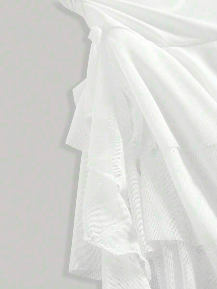 Tween girls sleeveless apricot A-line dress featuring an asymmetrical neck, contrast lace trim, and a flared hem.
