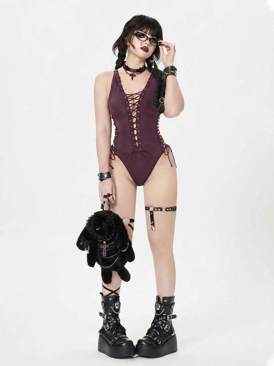 Black rock style goth halter one-piece swimsuit for women featuring metal grommet criss-cross lace-up detail.