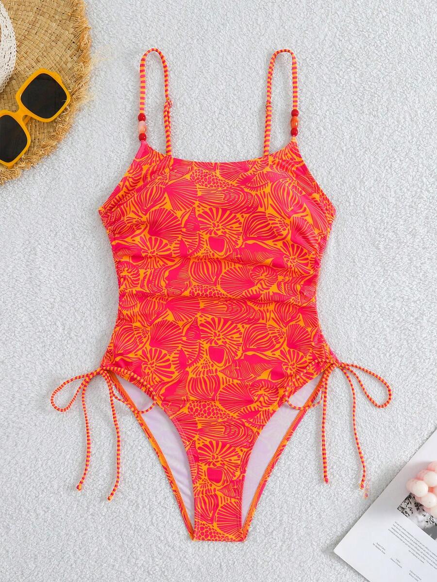 Women's blue backless one-piece swimsuit featuring spaghetti straps, wireless bra with removable padding, and drawstring details.