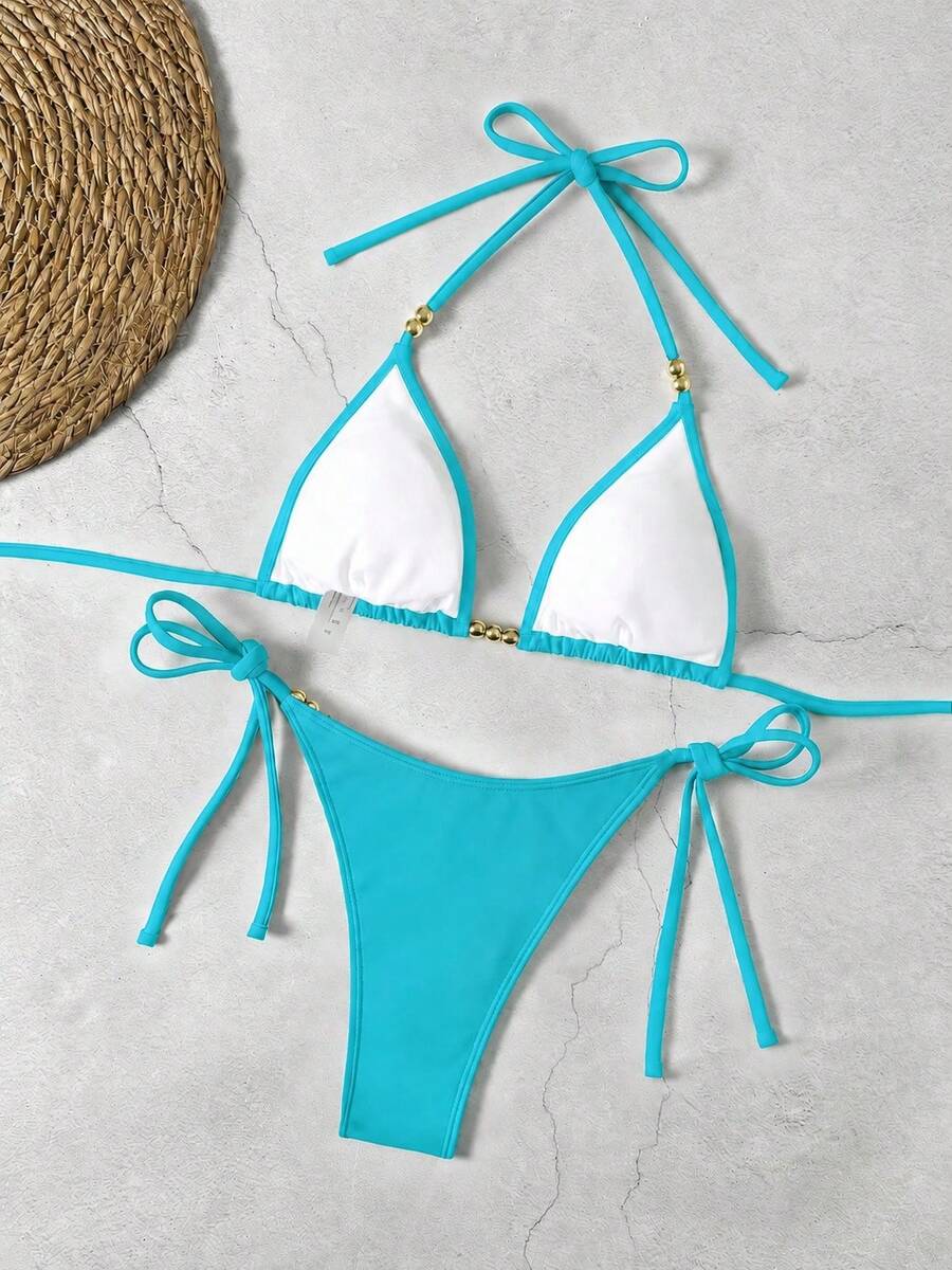 Women's black halter bikini set featuring triangle cups with gold bead decor and tie-back closure