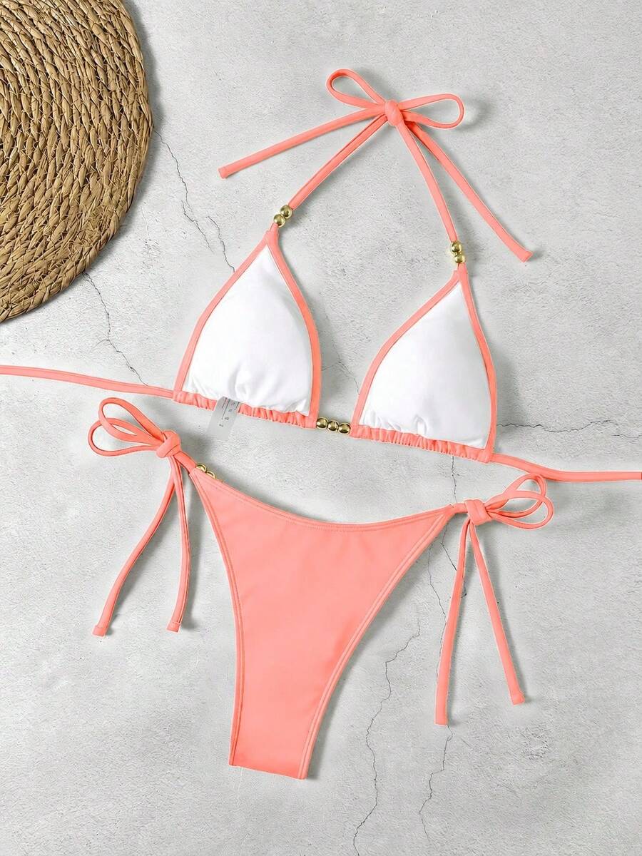 Women's black halter bikini set featuring triangle cups with gold bead decor and tie-back closure