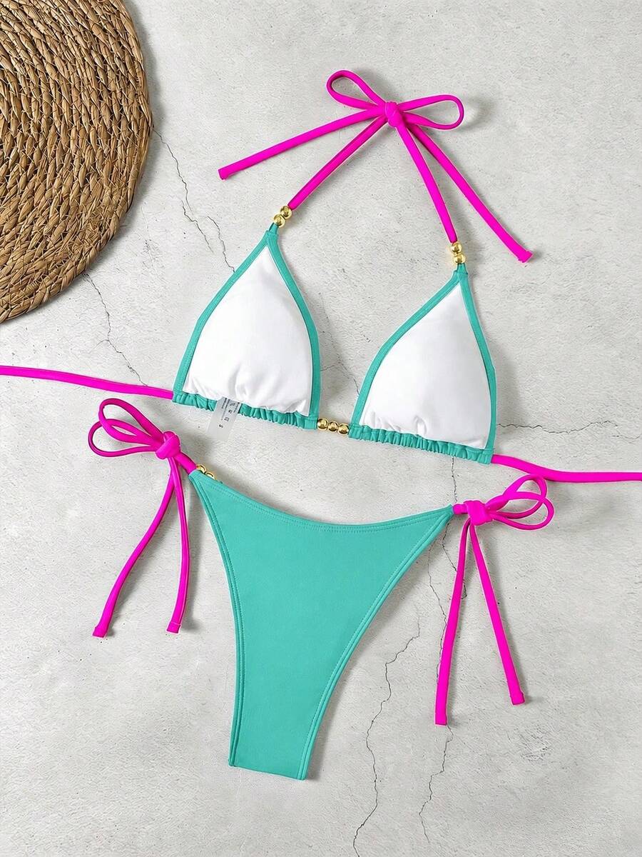 Women's black halter bikini set featuring triangle cups with gold bead decor and tie-back closure