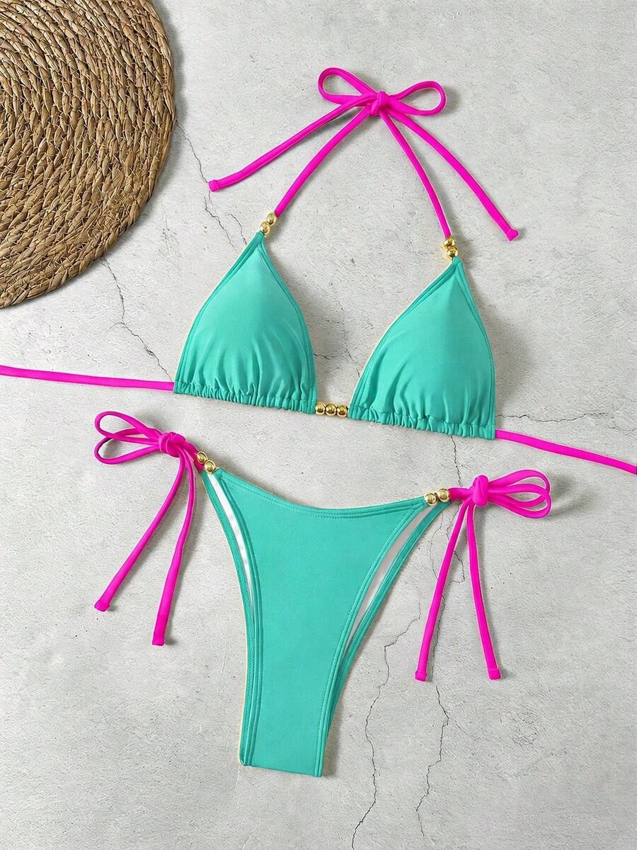 Women's black halter bikini set featuring triangle cups with gold bead decor and tie-back closure