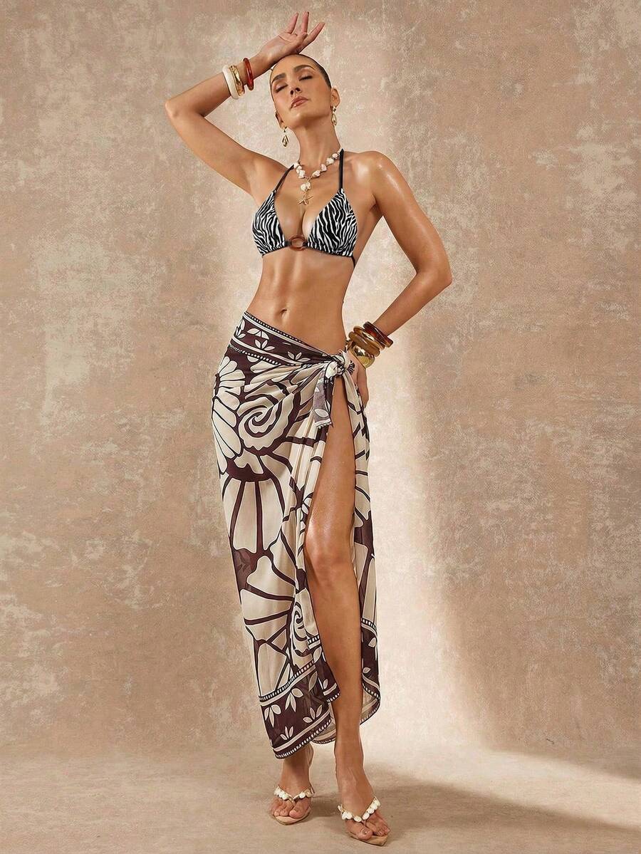 Women's black and white halter triangle bikini top and high waist tie side thong bottoms set.