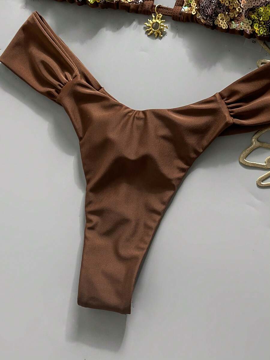 Women's 2-piece triangle cup bikini set in solid color featuring woven pearl shell decoration, halter neckline, and high-waist side-tie ruched bottoms.