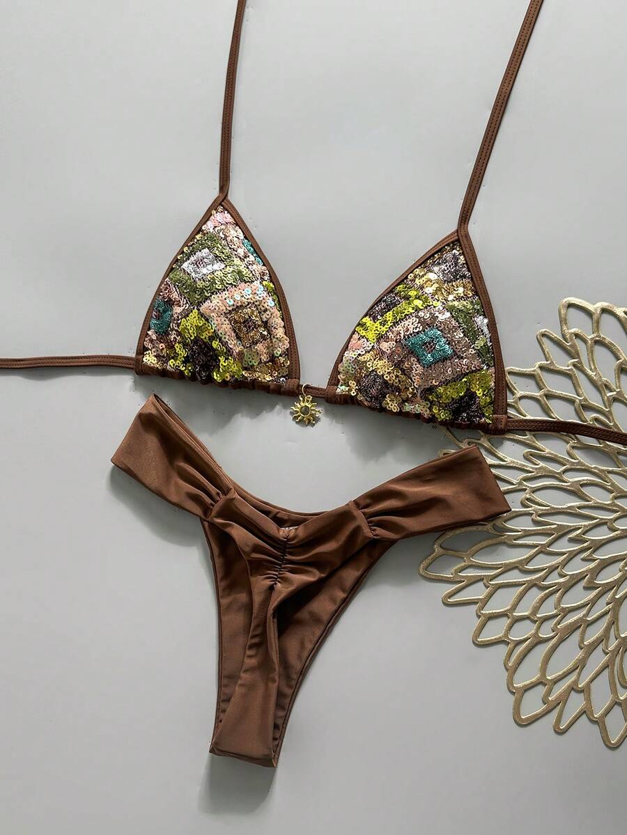 Women's 2-piece triangle cup bikini set in solid color featuring woven pearl shell decoration, halter neckline, and high-waist side-tie ruched bottoms.