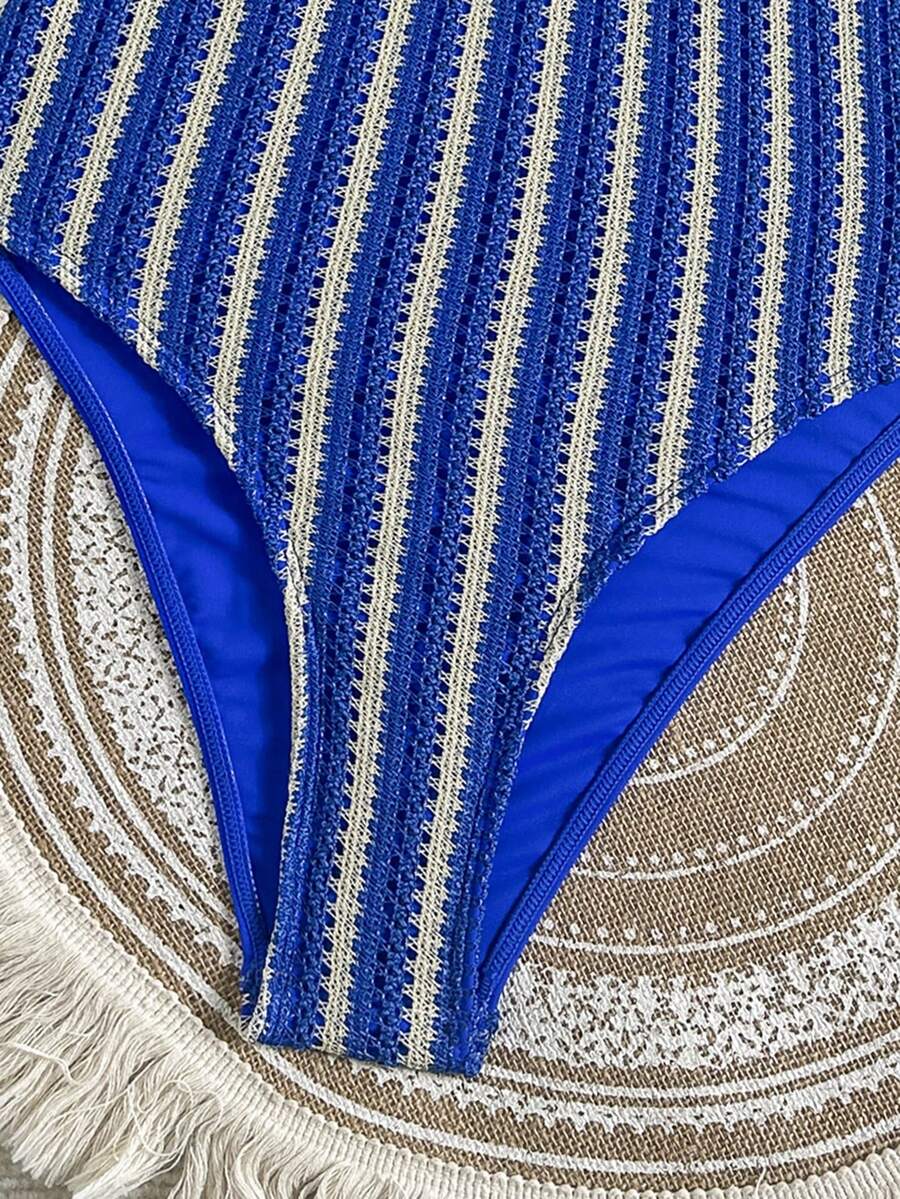 Women's solid color one-piece swimsuit featuring a backless scoop neck design and high cut fit