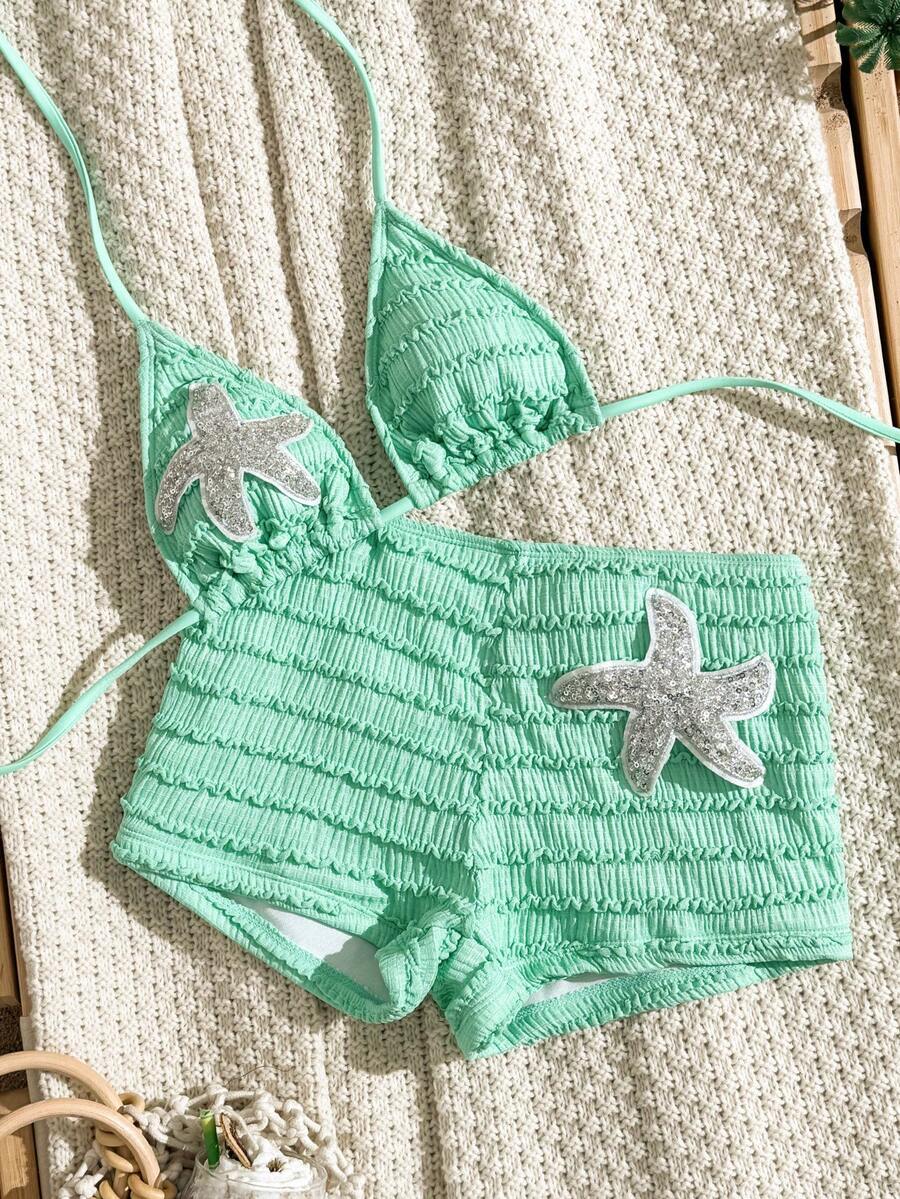 Women's apricot two-piece swimsuit set with a halter tie-back top and matching high stretch shorts.