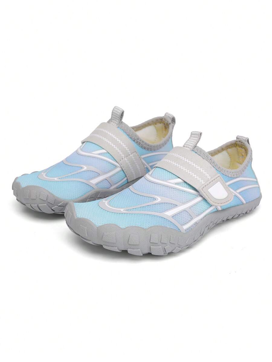 Black kids water shoes with graphic pattern, fabric upper, hook and loop closure, and non-slip rubber outsole for boys and girls.