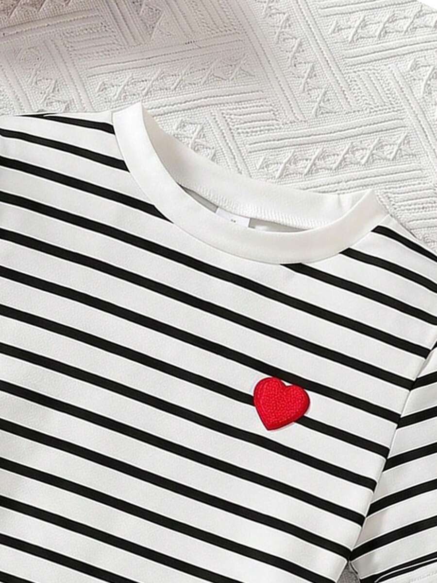 Girls black striped midi dress featuring short sleeves, round neck, slim fit, and flared hem.