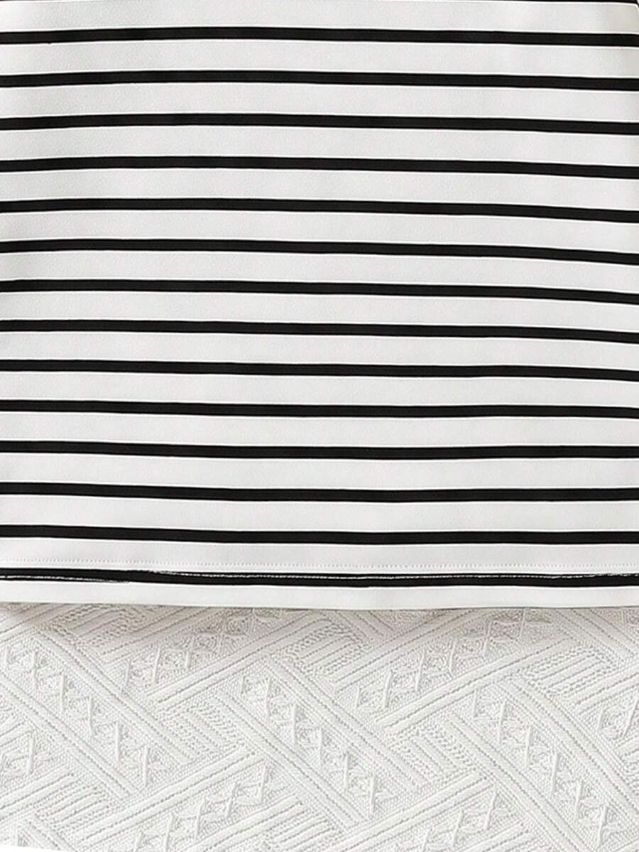 Girls black striped midi dress featuring short sleeves, round neck, slim fit, and flared hem.