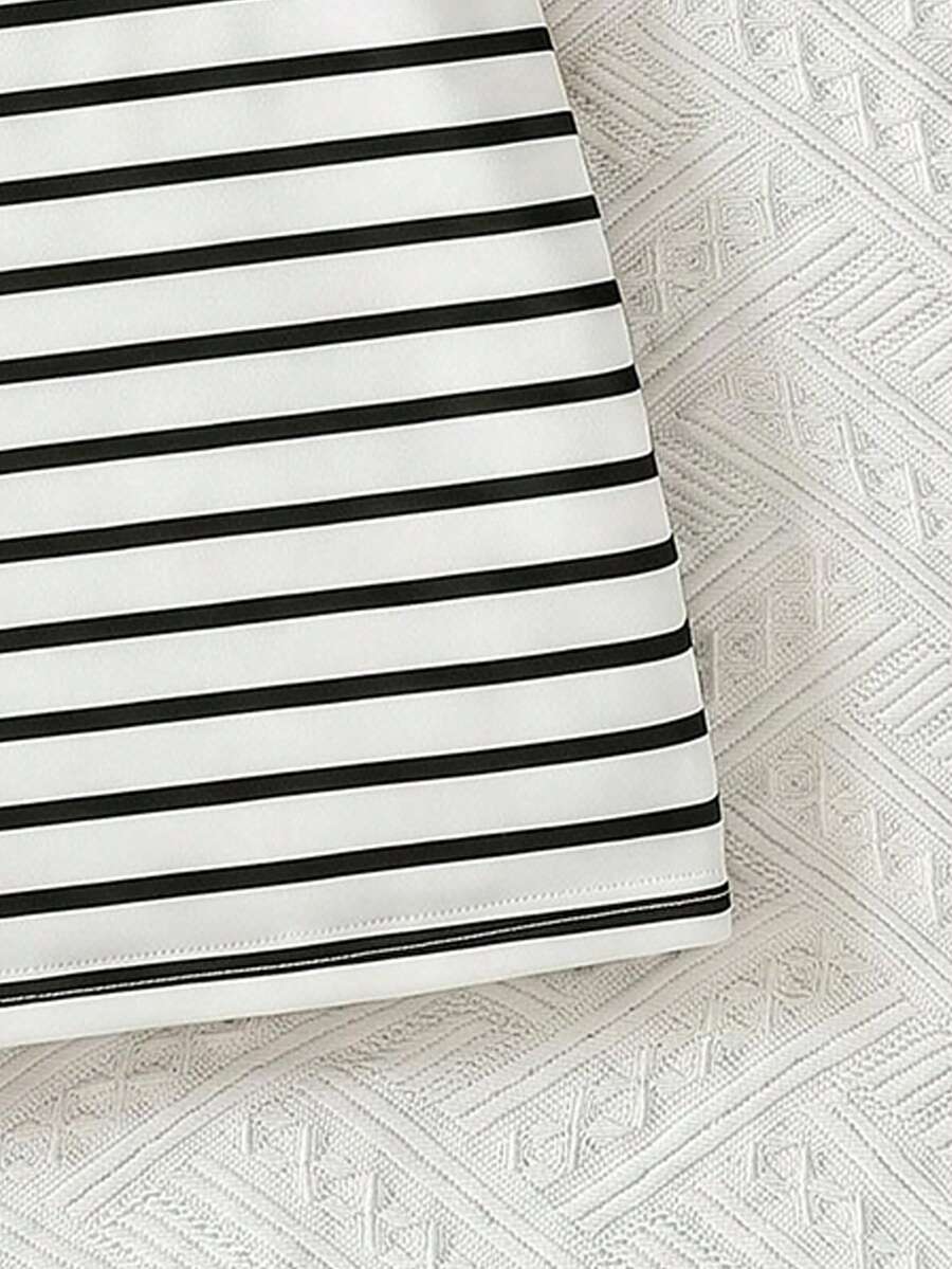 Girls black striped midi dress featuring short sleeves, round neck, slim fit, and flared hem.