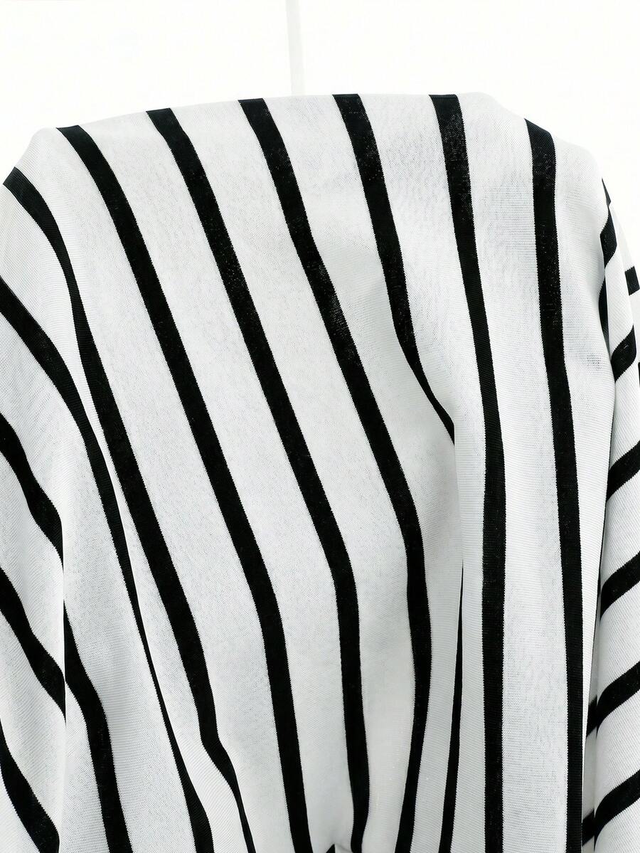 Girls black striped midi dress featuring short sleeves, round neck, slim fit, and flared hem.
