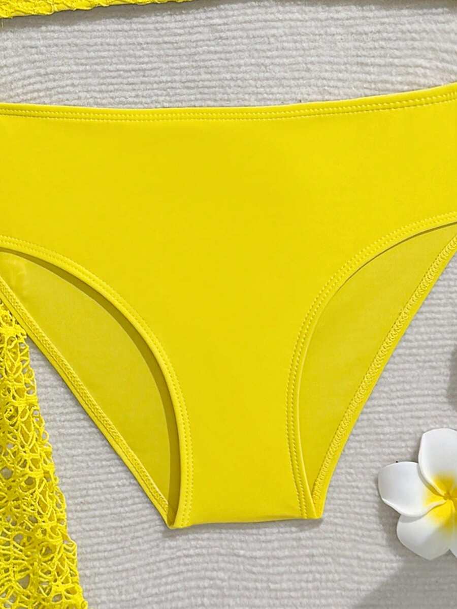 Tween girls beige bikini set with long sleeve round neck top, hollow-out asymmetrical details, mid-waist bottoms, and cover up for beach or vacation swimwear