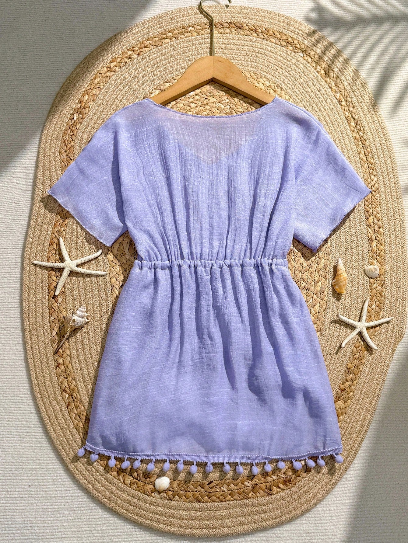 White tween girls swimsuit cover-up with V neck, short sleeves, contrast lace, fringe details, and regular length mesh fabric for beachwear