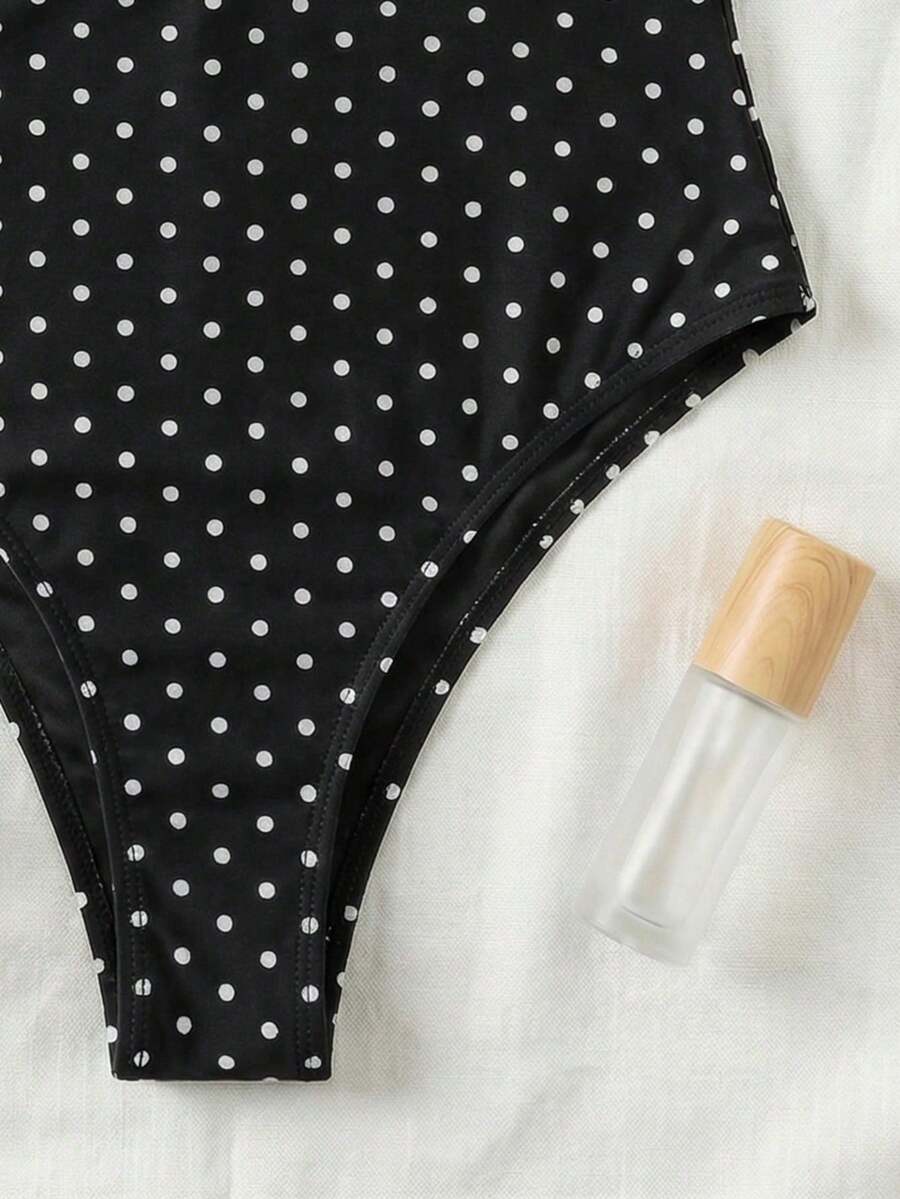 Black colorblock women's one-piece swimsuit with spaghetti straps and high stretch fabric.