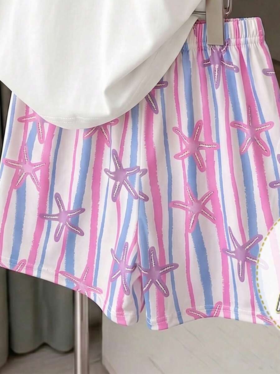Girls' multicolor short sleeve T-shirt and shorts set featuring a cute cherry and bow print with round neck top and matching shorts.