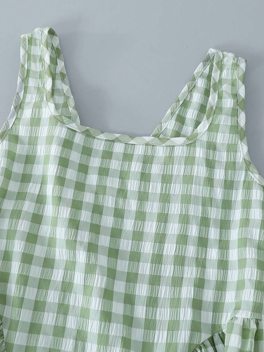 Black and white polka dot sleeveless A-line dress for tween girls featuring a scoop neck, high waist, and flared hem.