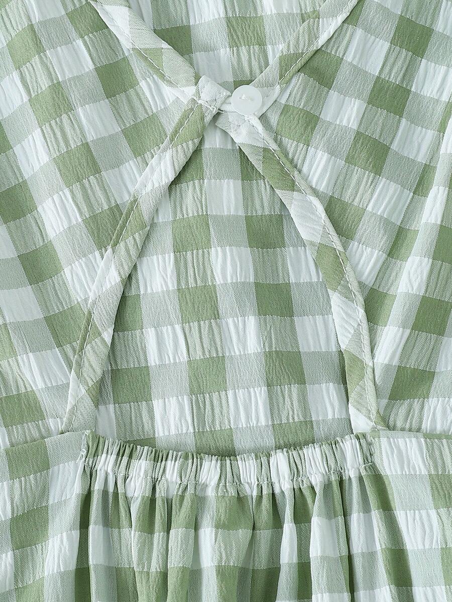 Black and white polka dot sleeveless A-line dress for tween girls featuring a scoop neck, high waist, and flared hem.