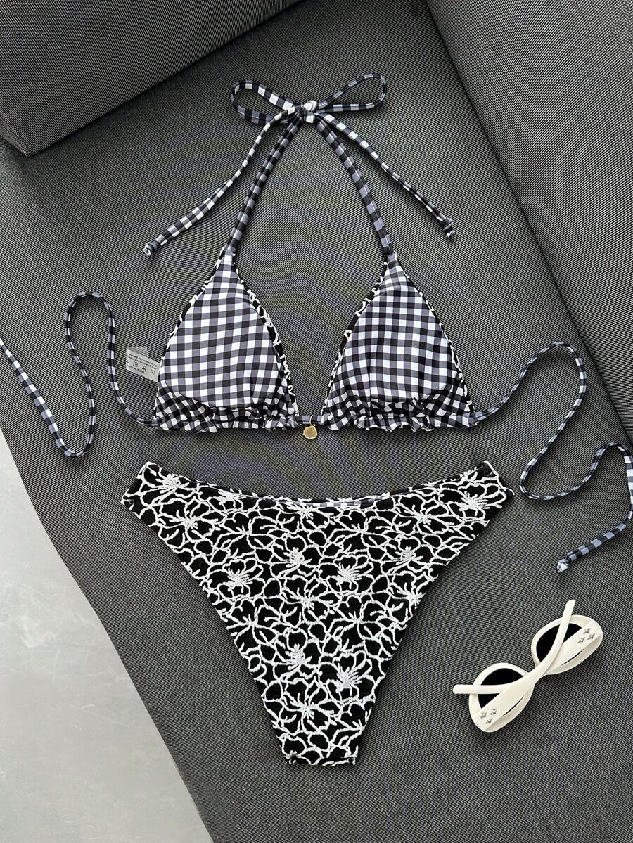 Women's black textured plaid 2-piece bikini set featuring a halter neckline, wireless triangle cups with removable padding, and mid-waist bottoms.