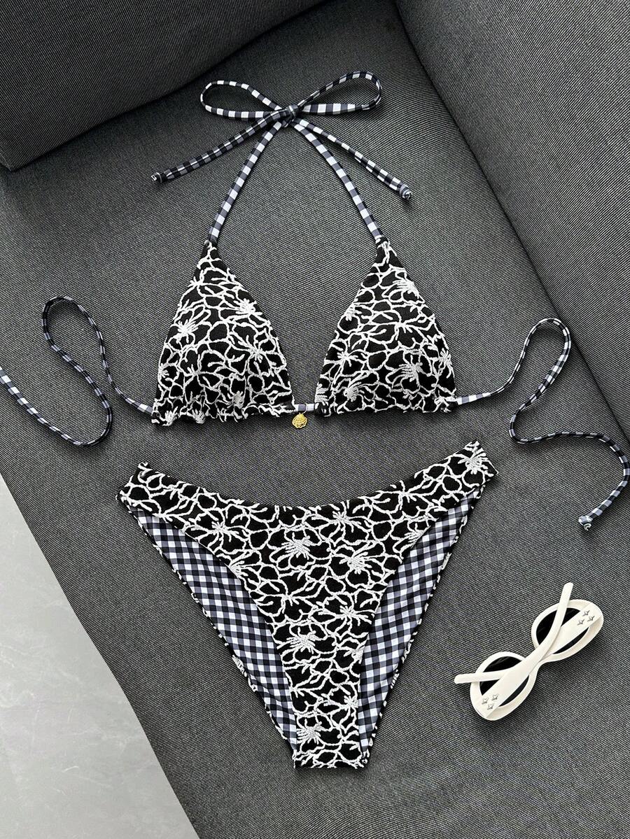 Women's black textured plaid 2-piece bikini set featuring a halter neckline, wireless triangle cups with removable padding, and mid-waist bottoms.