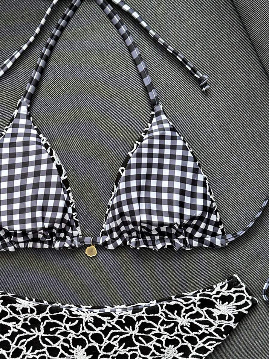 Women's black textured plaid 2-piece bikini set featuring a halter neckline, wireless triangle cups with removable padding, and mid-waist bottoms.