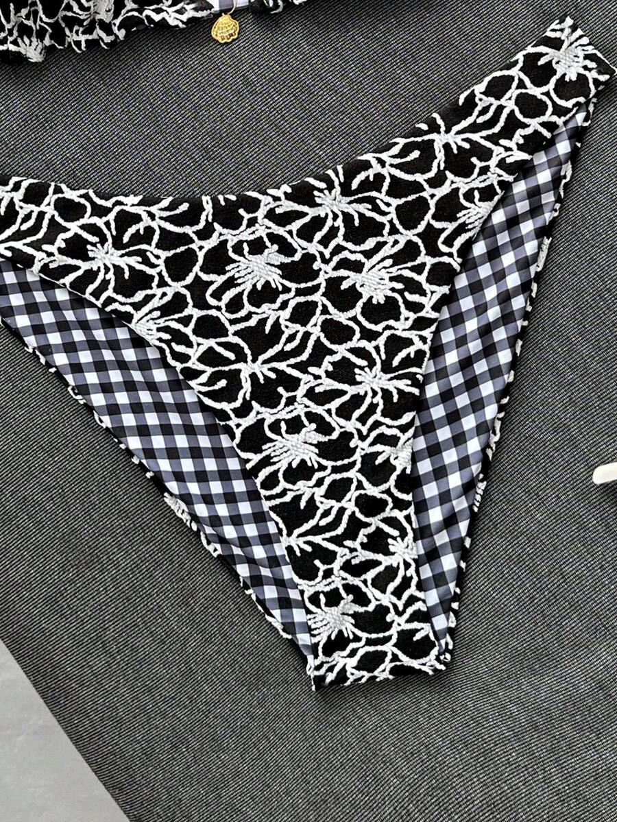 Women's black textured plaid 2-piece bikini set featuring a halter neckline, wireless triangle cups with removable padding, and mid-waist bottoms.