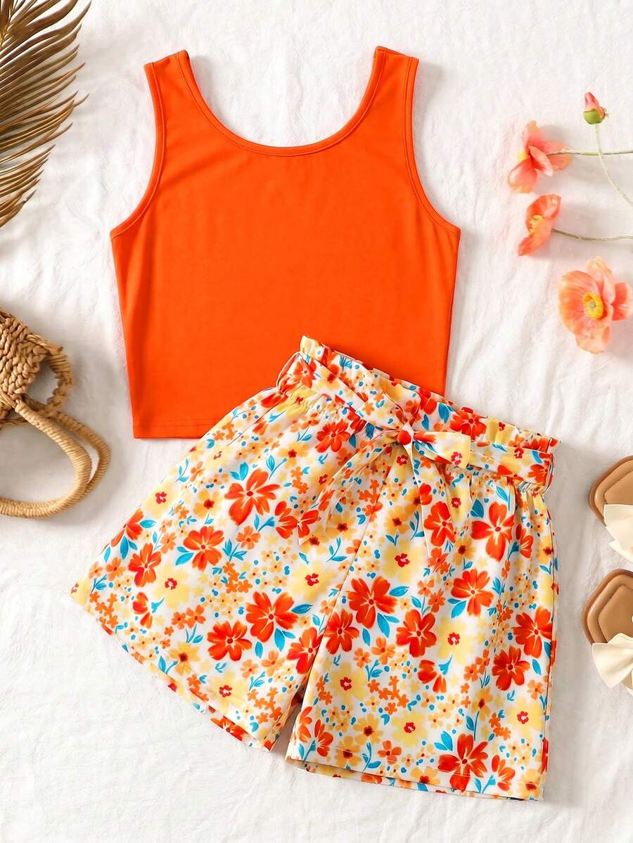 Tween girls 2-piece summer set featuring a turquoise blue ribbed tank top and tropical leaf pattern belted shorts.