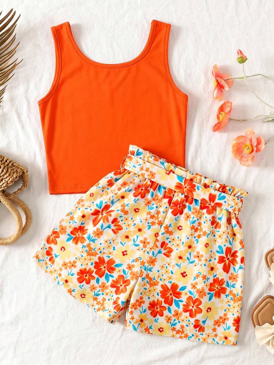 Tween girls 2-piece summer set featuring a turquoise blue ribbed tank top and tropical leaf pattern belted shorts.
