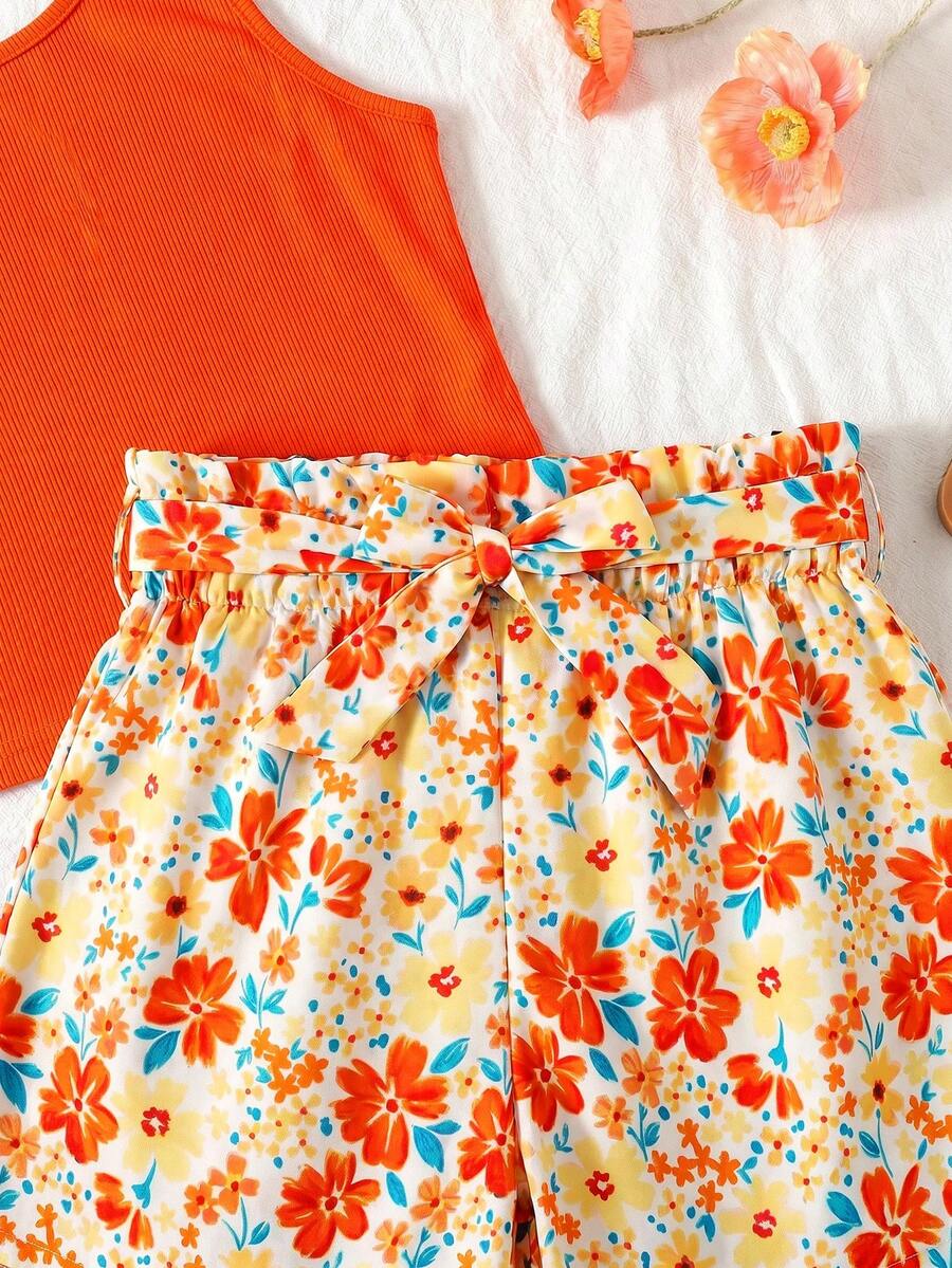 Tween girls 2-piece summer set featuring a turquoise blue ribbed tank top and tropical leaf pattern belted shorts.