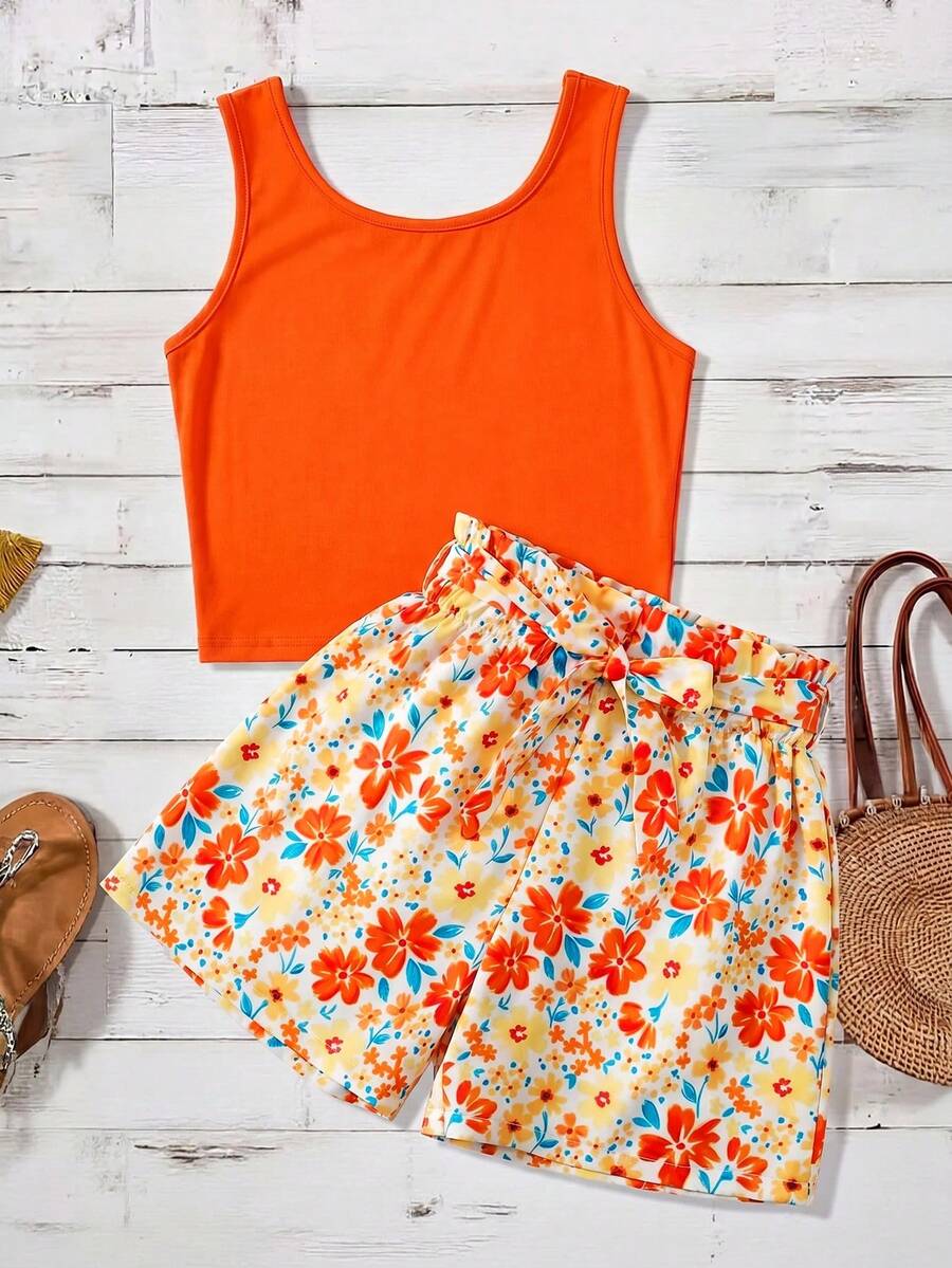 Tween girls 2-piece summer set featuring a turquoise blue ribbed tank top and tropical leaf pattern belted shorts.