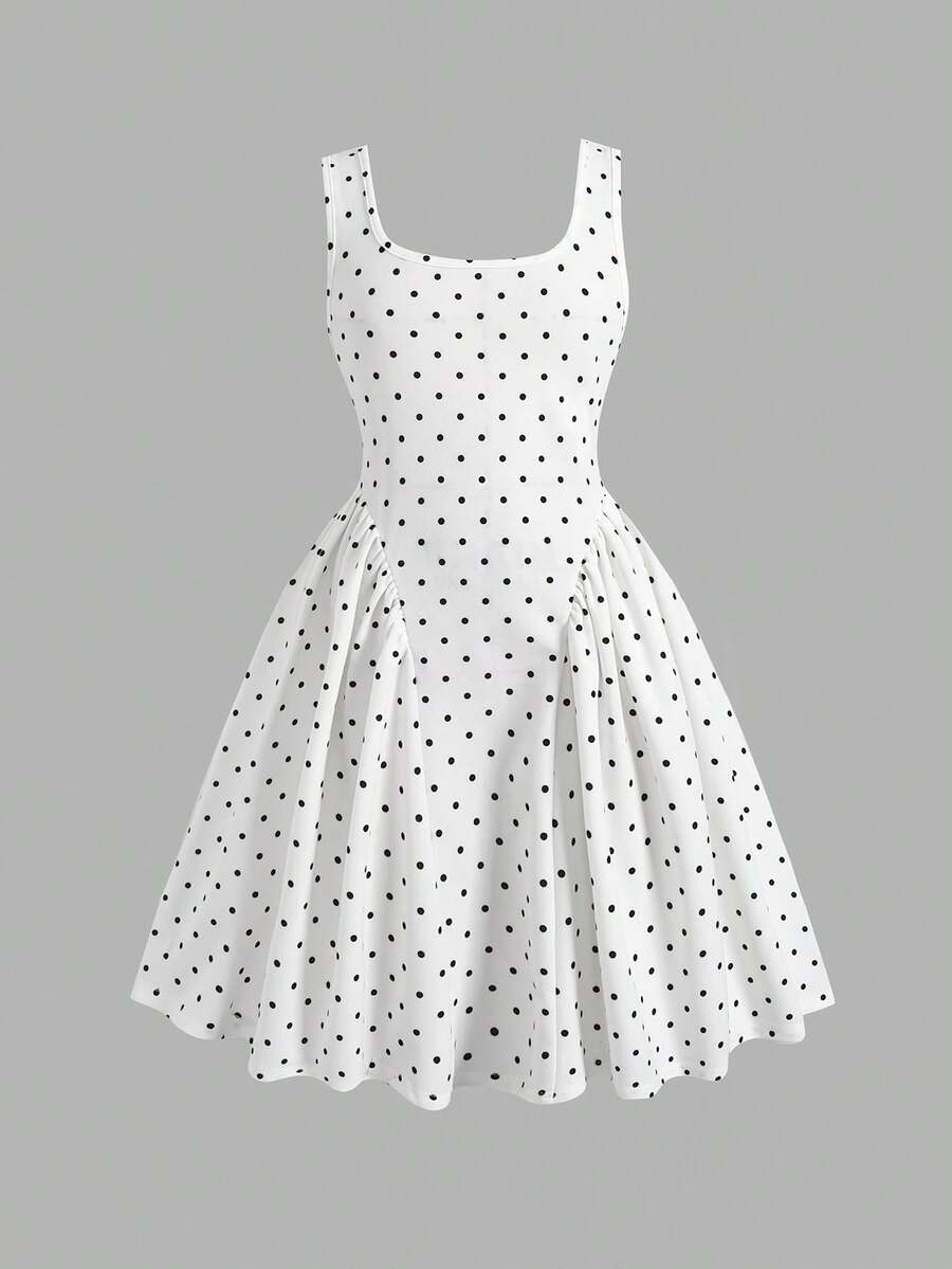 Black and white polka dot sleeveless A-line dress for tween girls featuring a scoop neck, high waist, and flared hem.