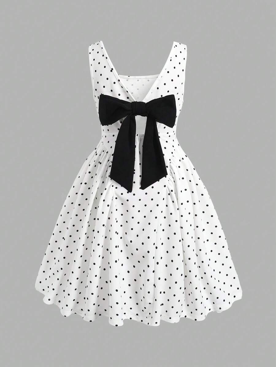 Black and white polka dot sleeveless A-line dress for tween girls featuring a scoop neck, high waist, and flared hem.