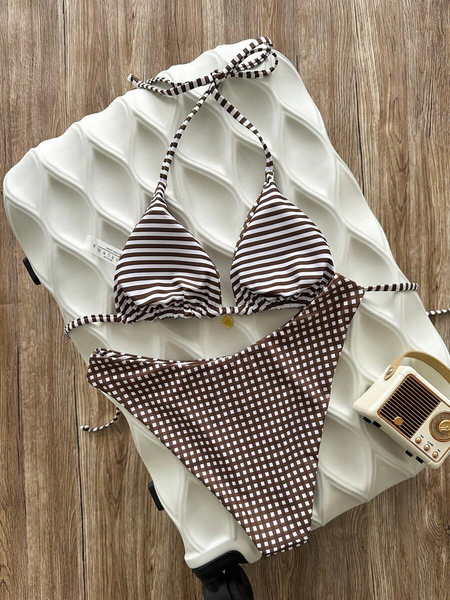 Women's black textured plaid 2-piece bikini set featuring a halter neckline, wireless triangle cups with removable padding, and mid-waist bottoms.