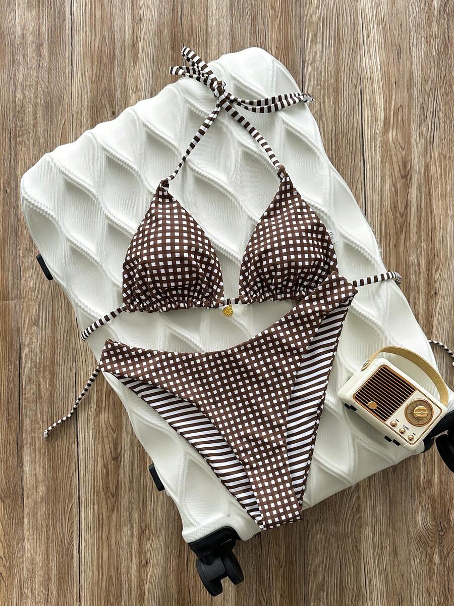 Women's black textured plaid 2-piece bikini set featuring a halter neckline, wireless triangle cups with removable padding, and mid-waist bottoms.