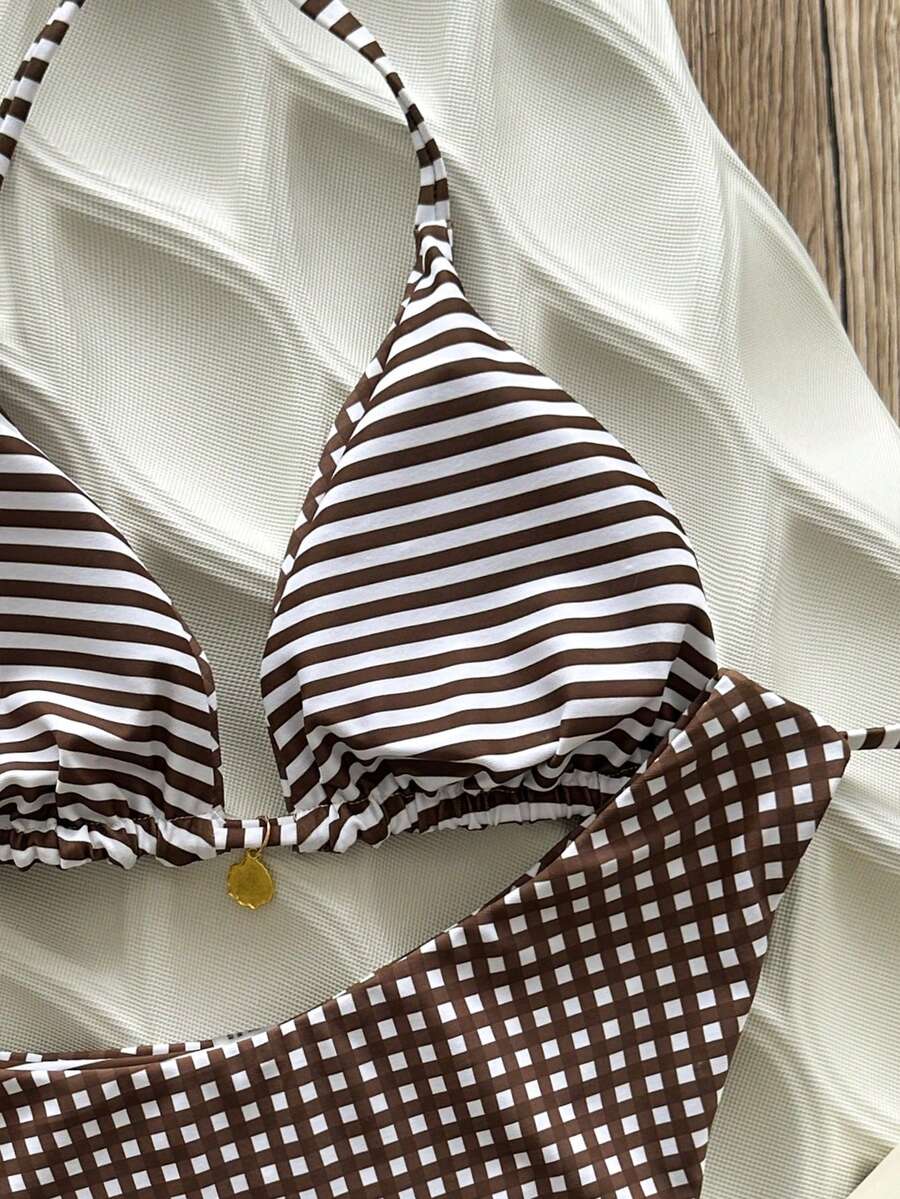 Women's black textured plaid 2-piece bikini set featuring a halter neckline, wireless triangle cups with removable padding, and mid-waist bottoms.