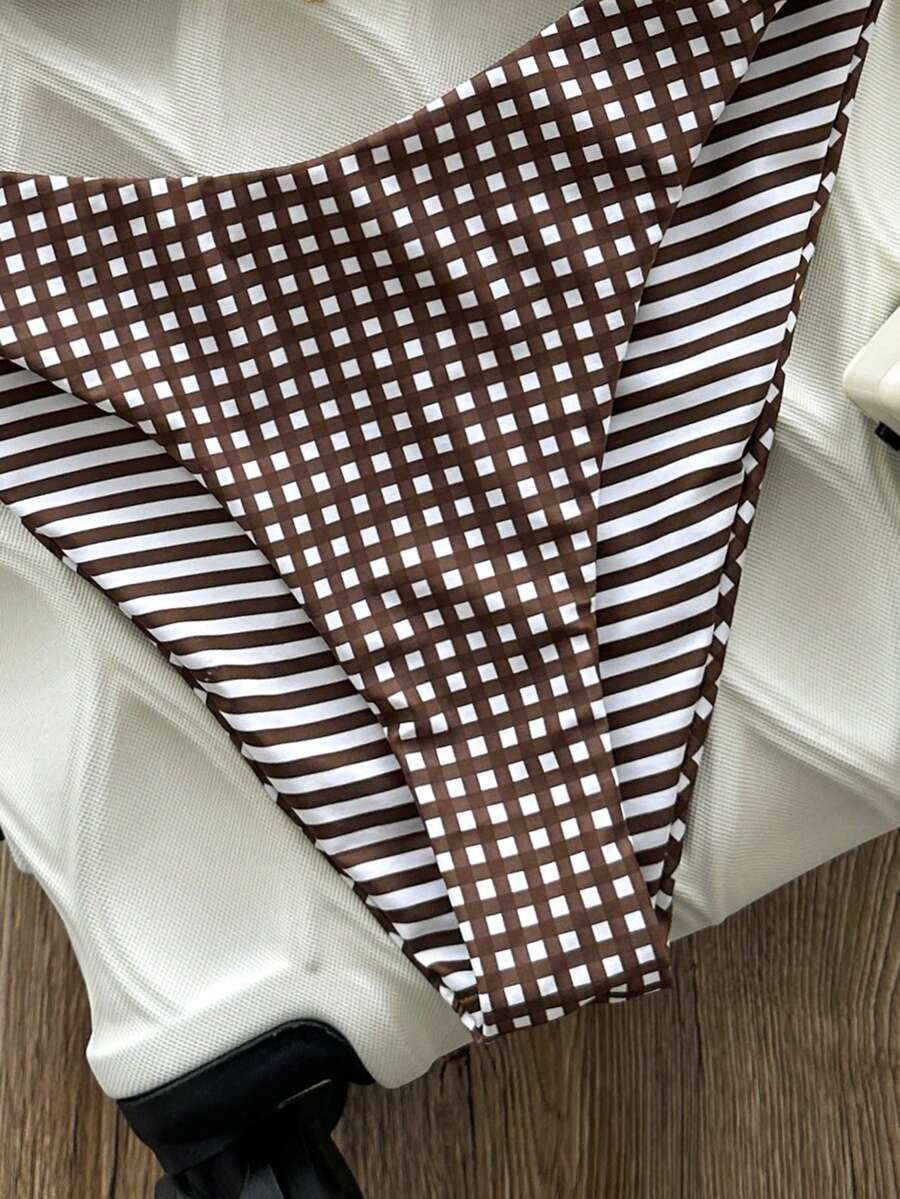 Women's black textured plaid 2-piece bikini set featuring a halter neckline, wireless triangle cups with removable padding, and mid-waist bottoms.