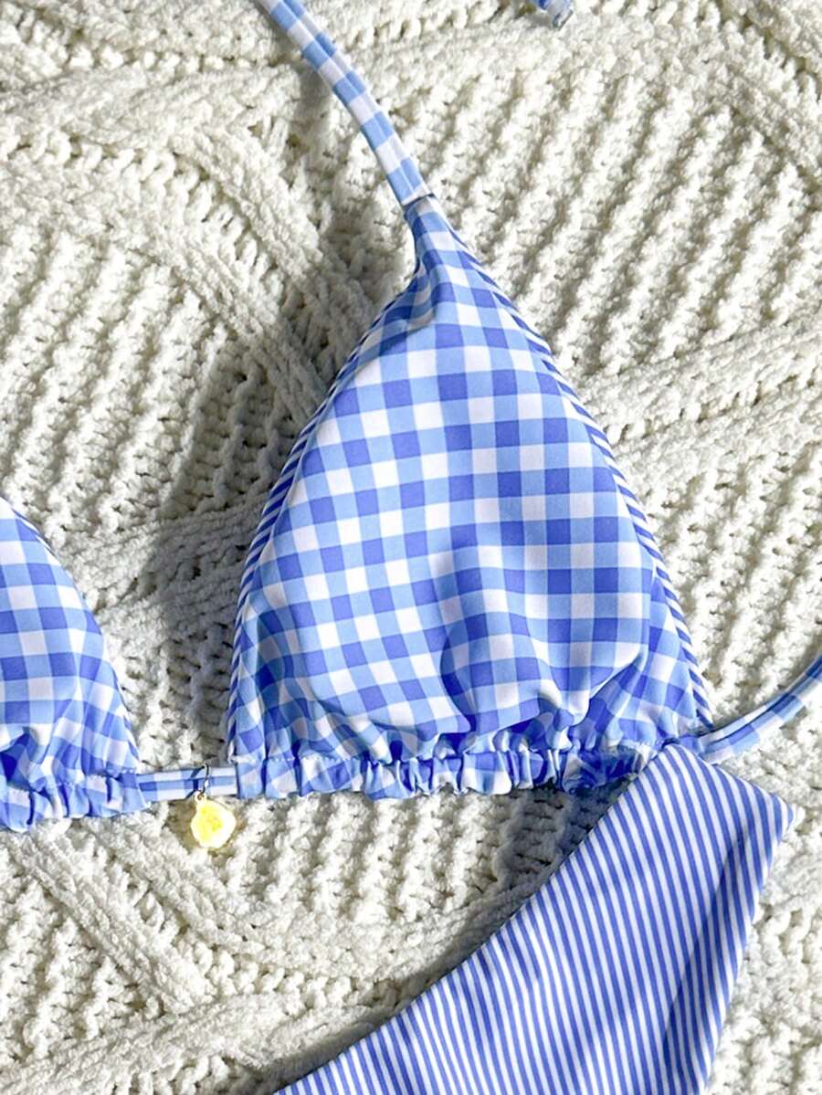 Women's black textured plaid 2-piece bikini set featuring a halter neckline, wireless triangle cups with removable padding, and mid-waist bottoms.
