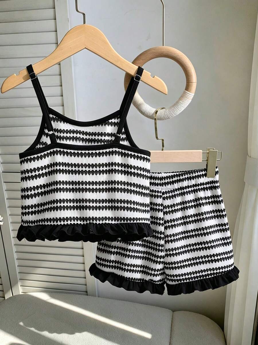 Tween girls black and white striped two-piece set featuring a spaghetti strap micro crop tank top with lettuce trim and ruffle hem paired with matching slim fit shorts.