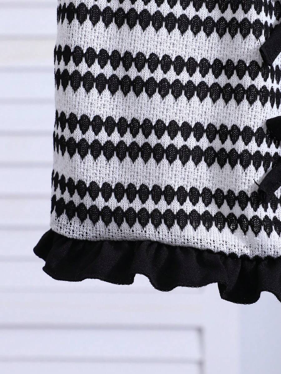 Tween girls black and white striped two-piece set featuring a spaghetti strap micro crop tank top with lettuce trim and ruffle hem paired with matching slim fit shorts.